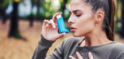 Photo of woman using Asthma Inhaler