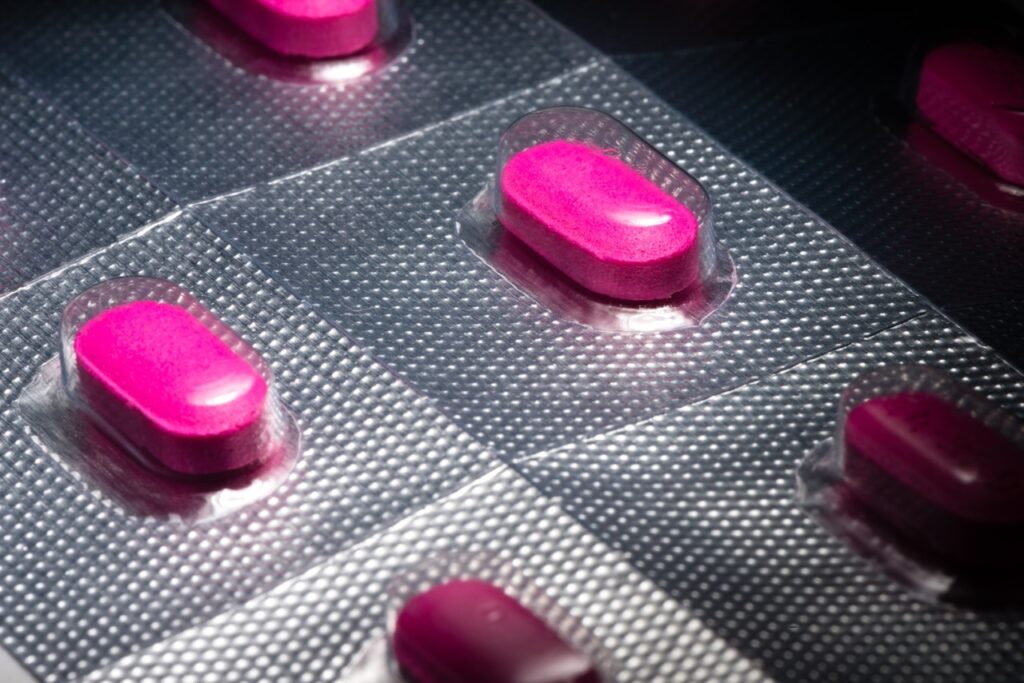 Pink antihistamine pills on blister pack for allergy testing prep