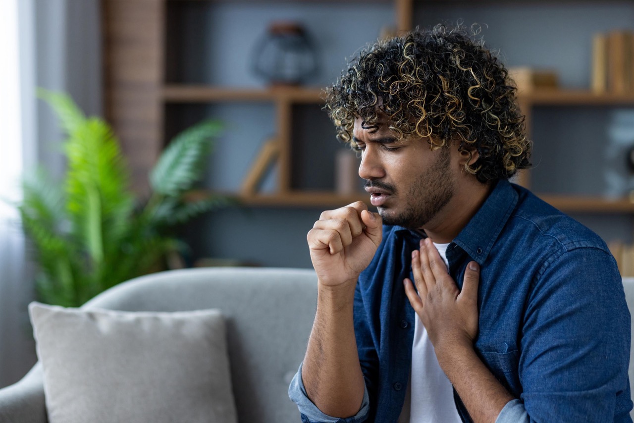 Man with cough and chest discomfort from allergy symptoms